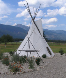 Salish Lodge with drying rack and native plants