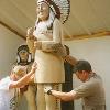 Chief Victor being placed in the new exhibit.