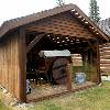 Replica of  two-wheeled ox cart and barn