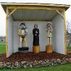 The Diorama was dedicated in 2005 to replace the previous element-worn carvings.  Depicted left to right are Chief Big Face, Fr. DeSmet and Chief Victor.