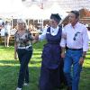 Director Colleen Meyer with the Ravallis at the celebration in their honor at the Mission Complex.